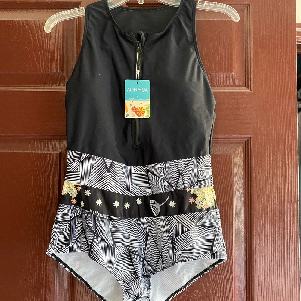 Black and floral one piece bathing suit